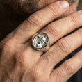 Load image into Gallery viewer, Polished silver Jesus Christ signet ring worn on finger, radiant cross halo detail, Christian signet style
