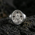 Load image into Gallery viewer, Polished silver Jesus Christ signet ring on porous volcanic stone, radiant cross halo design, Christian jewelry
