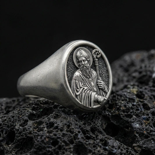 Oxidized 925 sterling silver Saint Benedict signet ring on volcanic rock, holy protector portrait relief, Catholic jewelry