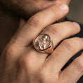 Load image into Gallery viewer, Rose gold plated Saint Benedict signet ring worn on finger, saint portrait relief, meaningful religious accessory
