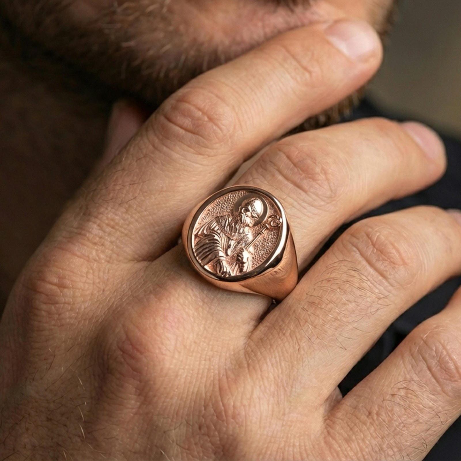 Rose gold plated Saint Benedict signet ring worn on finger, saint portrait relief, meaningful religious accessory