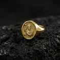 Load image into Gallery viewer, Gold plated Saint John the Baptist signet ring on dark volcanic rock, saint portrait relief, Christian jewelry
