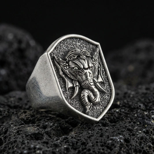 Oxidized 925 sterling silver Lord Ganesha signet ring on volcanic rock, elephant god relief, Hindu amulet jewelry