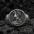 Load image into Gallery viewer, Oxidized 925 sterling silver St. George and the Dragon ring on volcanic rock, medieval knight seal relief
