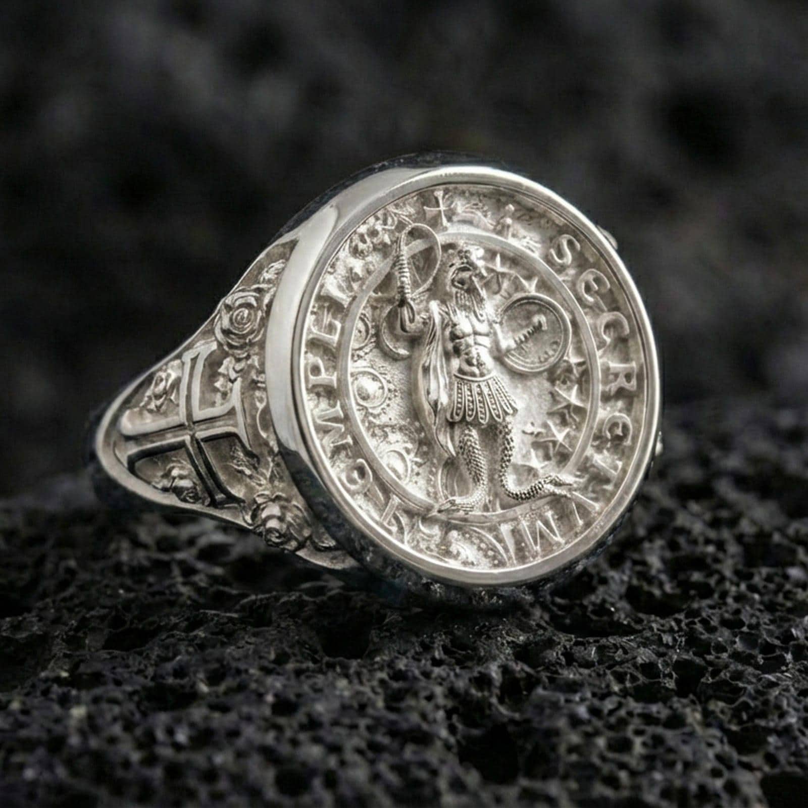 Polished silver Secretum Templi Templar ring on porous volcanic stone, medieval seal signet, crusader emblem