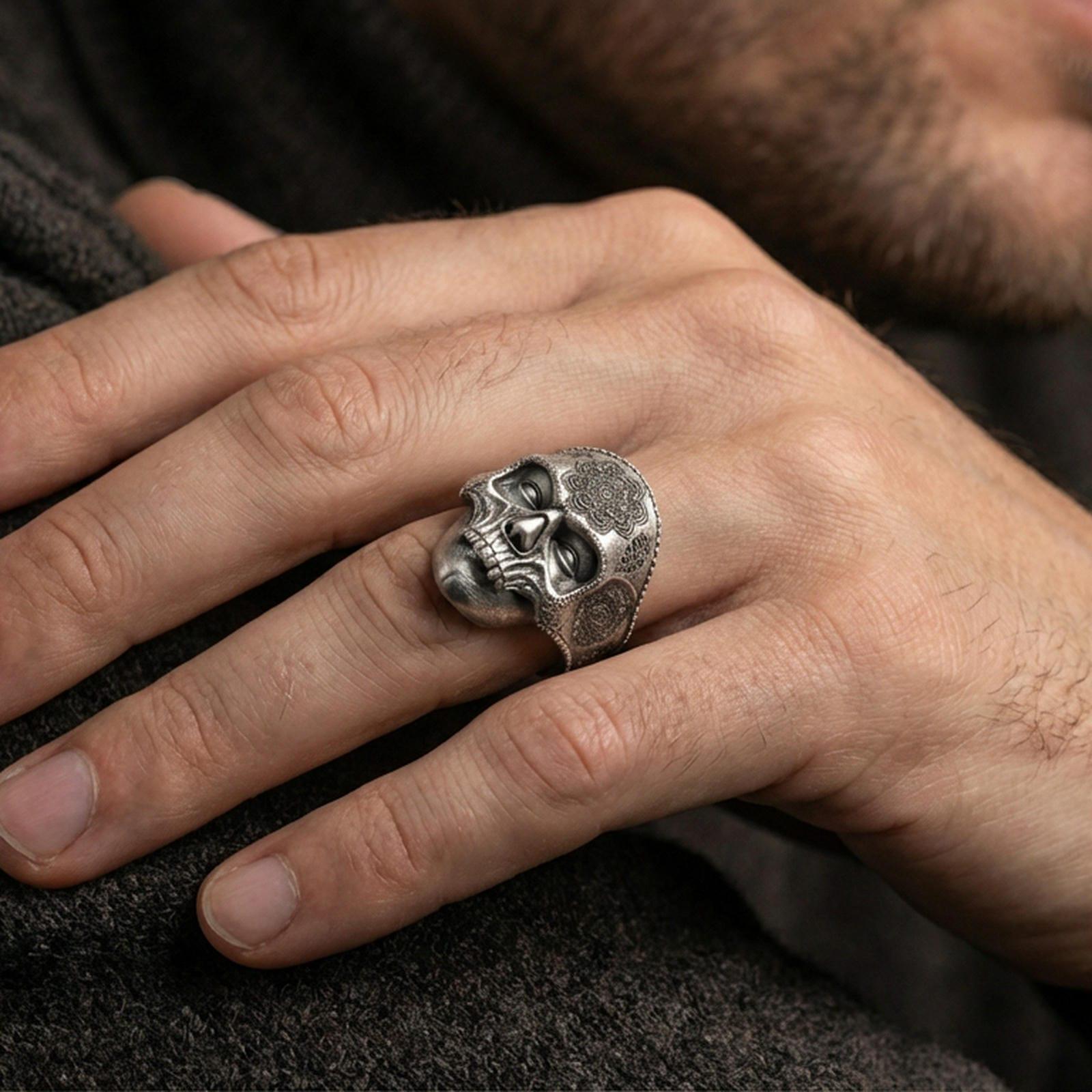 Oxidized 925 sterling silver skull mandala ring worn on finger, gothic memento mori biker statement style