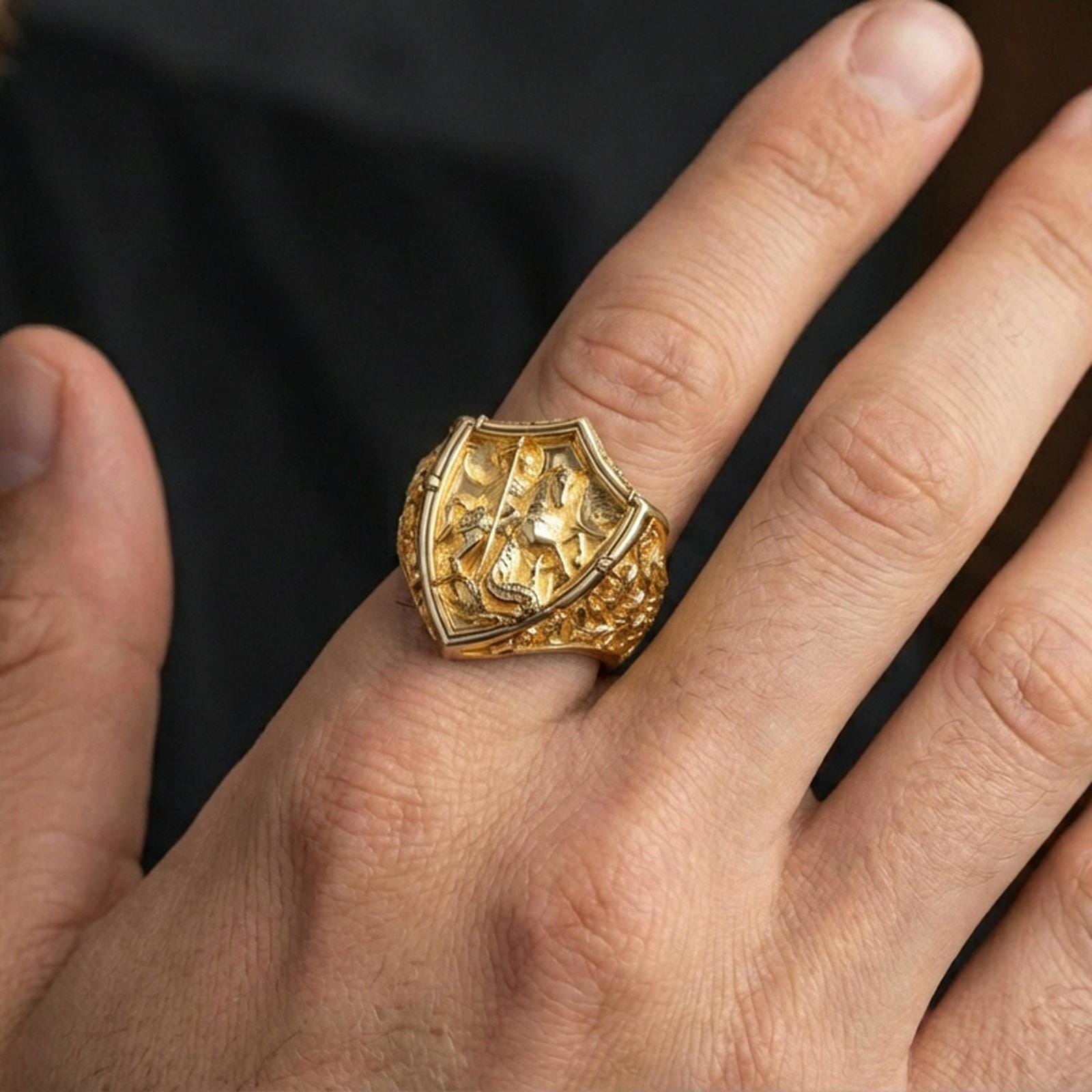 Gold plated Saint George and dragon shield ring worn on finger, heroic faith motif, bold medieval jewelry
