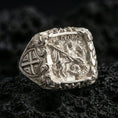Load image into Gallery viewer, Polished silver St George shield ring on porous volcanic stone, detailed cavalry relief with “ST. GEORGE” banner
