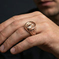 Load image into Gallery viewer, Rose gold plated St Michael signet ring worn on finger, archangel wings relief, unique faith gift jewelry
