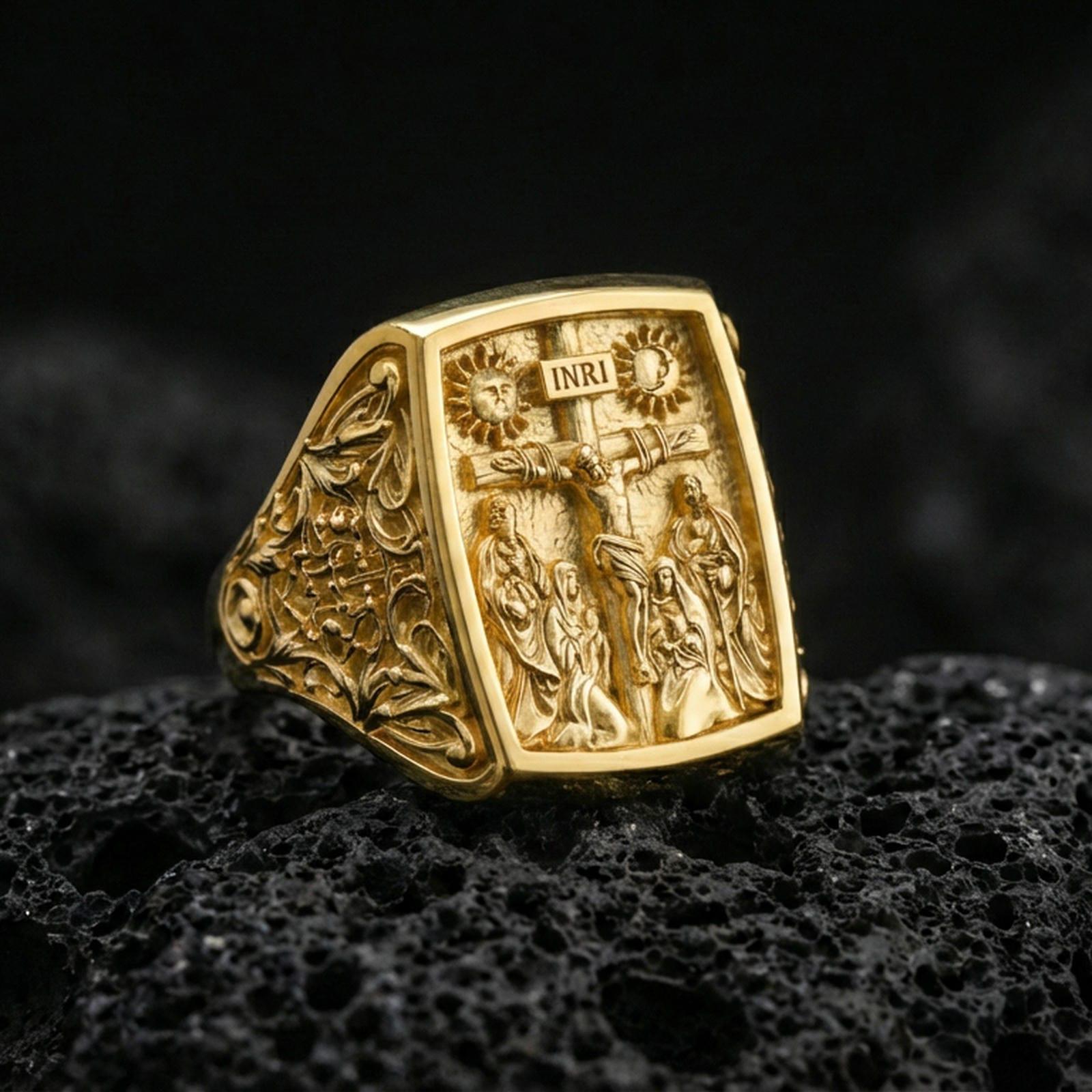 Gold plated sterling silver INRI crucifix signet ring on dark volcanic rock, raised Jesus cross relief, bold faith jewelry