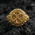 Load image into Gallery viewer, Gold plated sterling silver Chi Rho ring on dark volcanic rock, Alpha Omega emblem, Christian symbol signet jewelry
