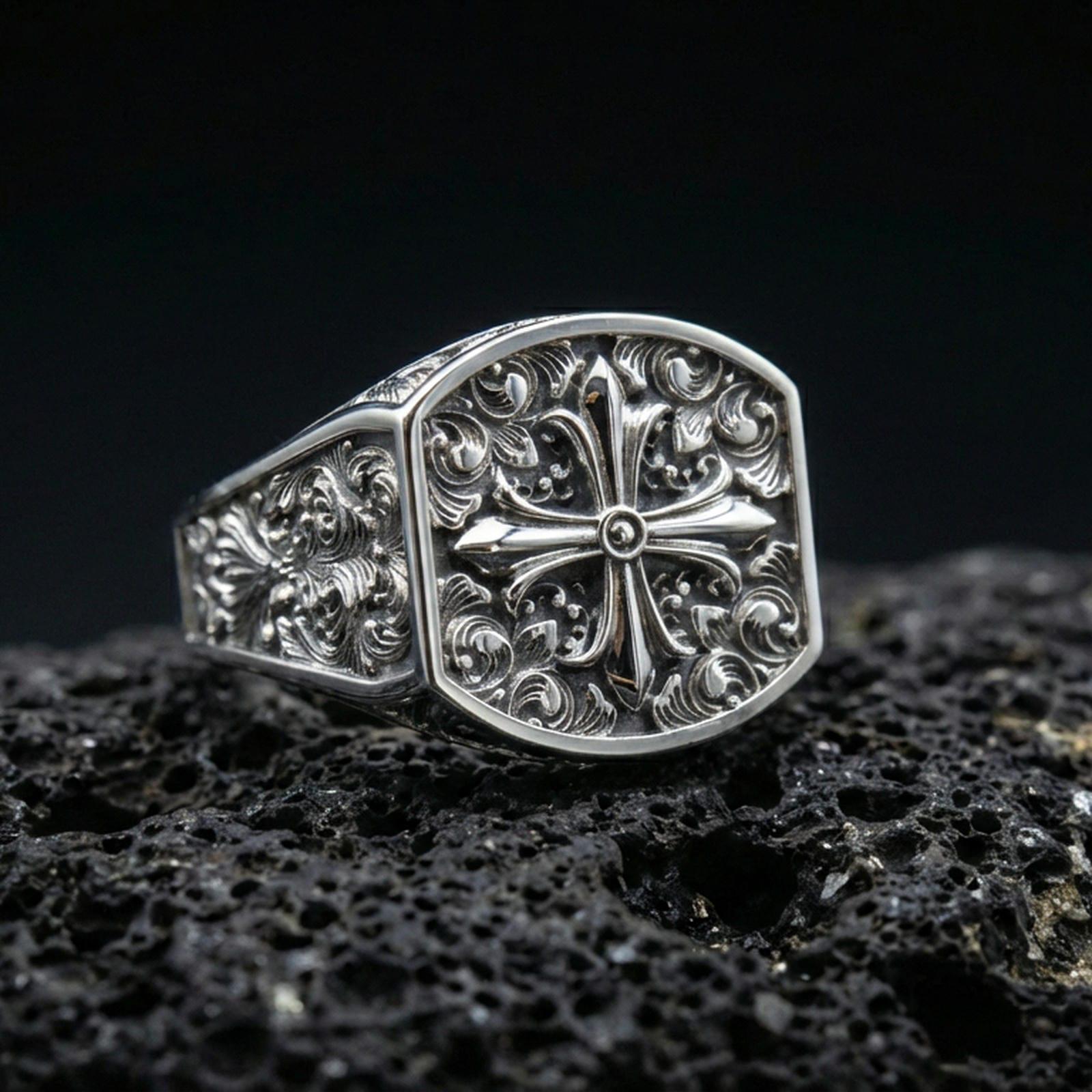 Polished silver baroque cross signet ring on porous volcanic stone, octagonal face, vintage engraved filigree