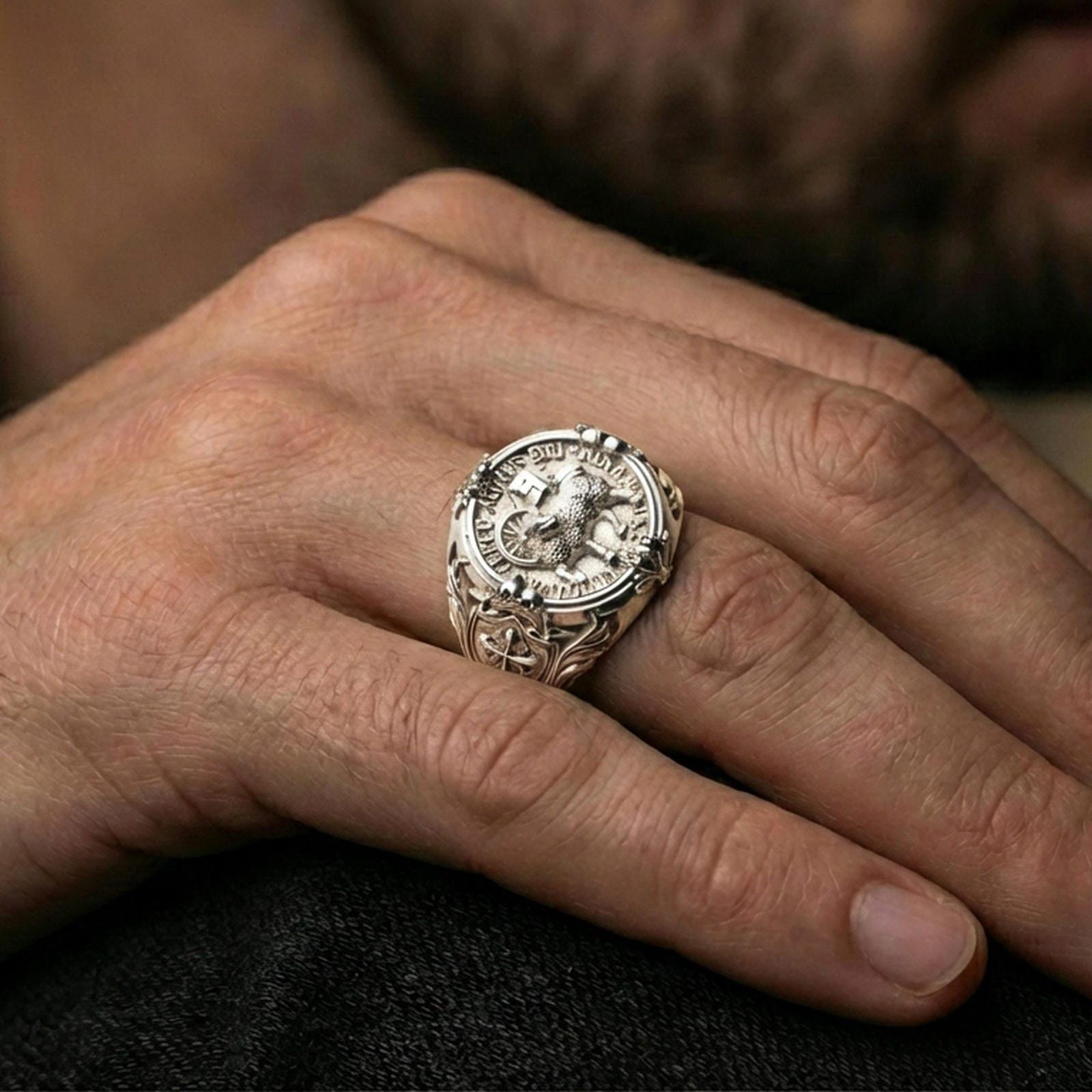 Polished silver Agnus Dei seal ring worn on finger, Lamb of God emblem, detailed Latin inscription and cross shoulder engraving