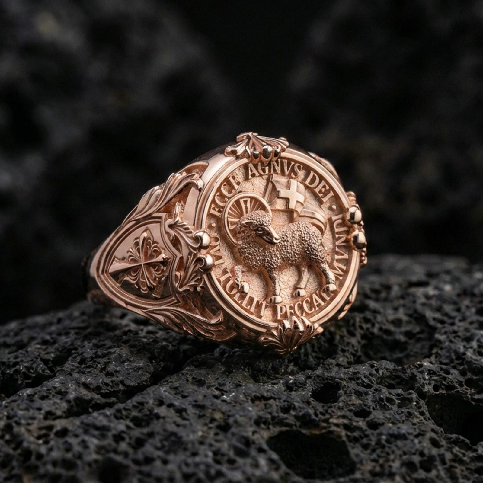 Rose gold plated Agnus Dei seal ring on volcanic stone, Lamb of God emblem signet face, vintage cross side engraving