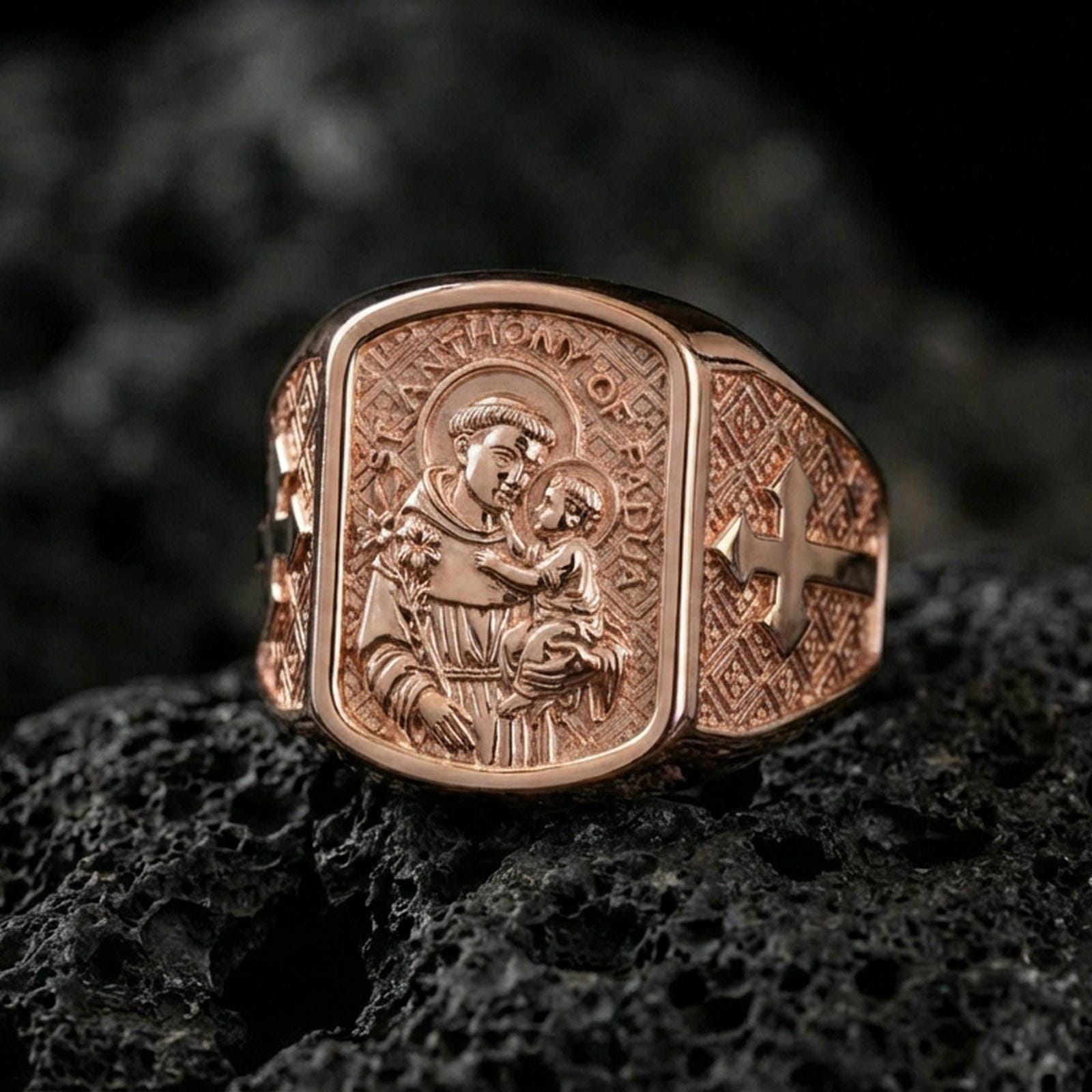 Rose gold plated Saint Anthony signet ring on volcanic stone, Saint Anthony relief with cross accents, devotional signet ring