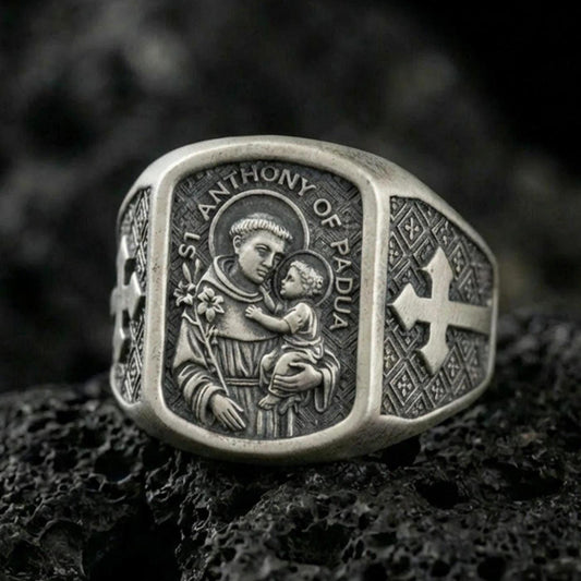 Oxidized 925 sterling silver Saint Anthony of Padua signet ring on volcanic rock, saint holding Child Jesus, Catholic devotional jewelry