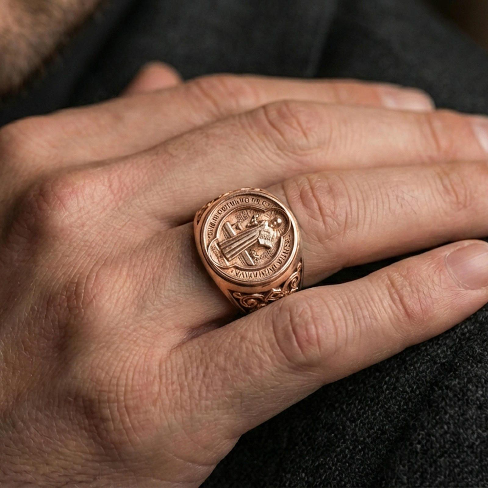 Rose gold plated St Benedict signet ring worn on finger, Benedict medal relief with Latin text, religious gift ring