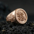 Load image into Gallery viewer, Rose gold plated Christian monogram signet ring on volcanic stone, engraved cross on band and ornate monogram face
