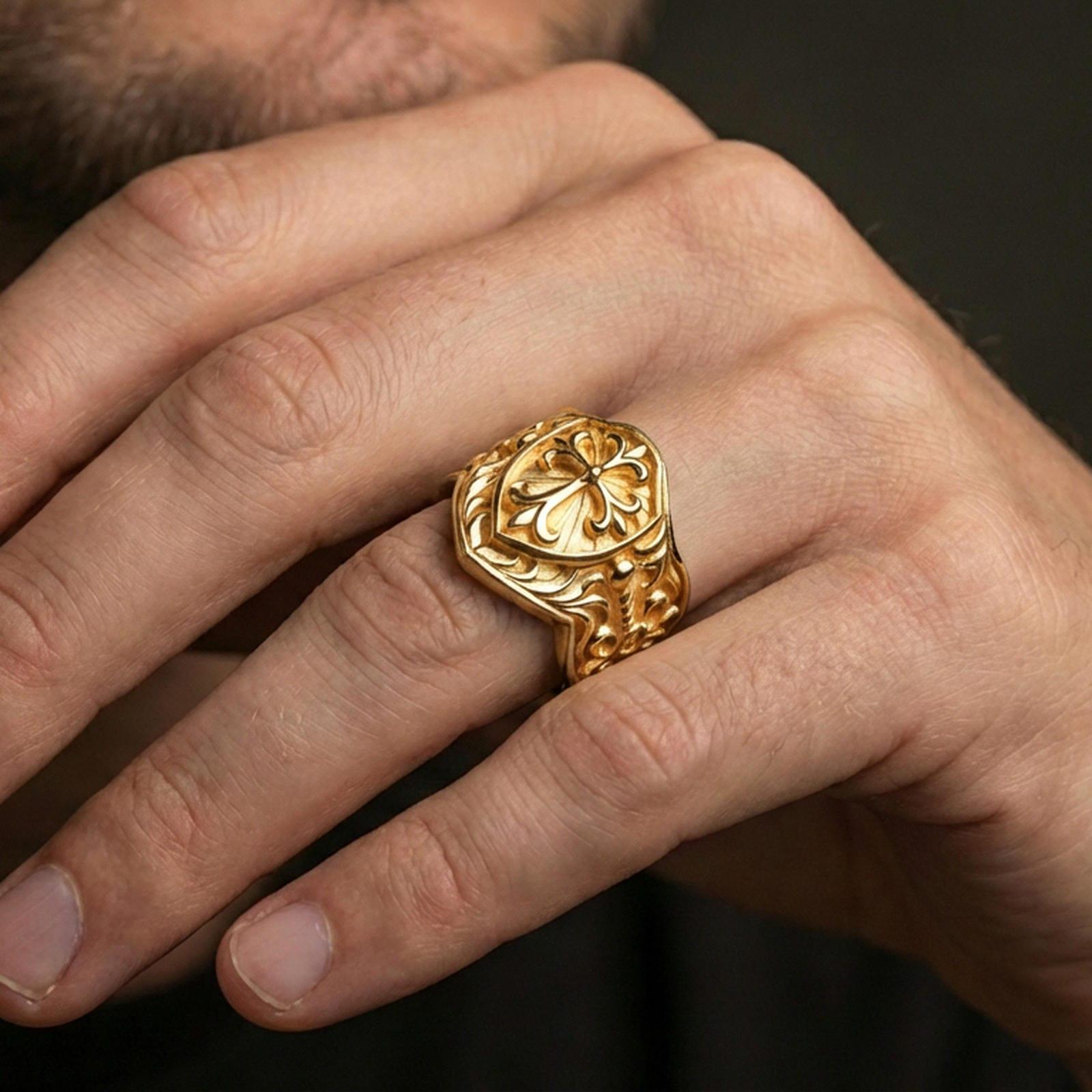 Gold plated heraldic cross shield ring worn on finger, vintage crest signet ring with ornate cross and engraved sides