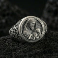 Load image into Gallery viewer, Oxidized 925 sterling silver Good Shepherd signet ring on volcanic rock, Jesus holding lamb relief with dark antiqued details
