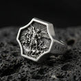 Load image into Gallery viewer, Oxidized 925 sterling silver Saint Michael ring on volcanic rock, octagon signet with Archangel defeating dragon relief
