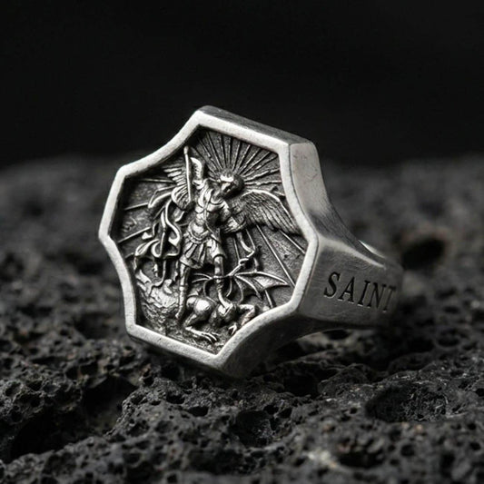 Oxidized 925 sterling silver Saint Michael ring on volcanic rock, octagon signet with Archangel defeating dragon relief