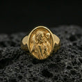 Load image into Gallery viewer, Gold plated Jesus the Good Shepherd signet ring on dark volcanic rock, detailed shepherd and lamb relief medallion face
