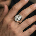 Load image into Gallery viewer, Polished silver Good Shepherd signet ring worn on finger, oval bezel Jesus portrait with lamb over shoulders
