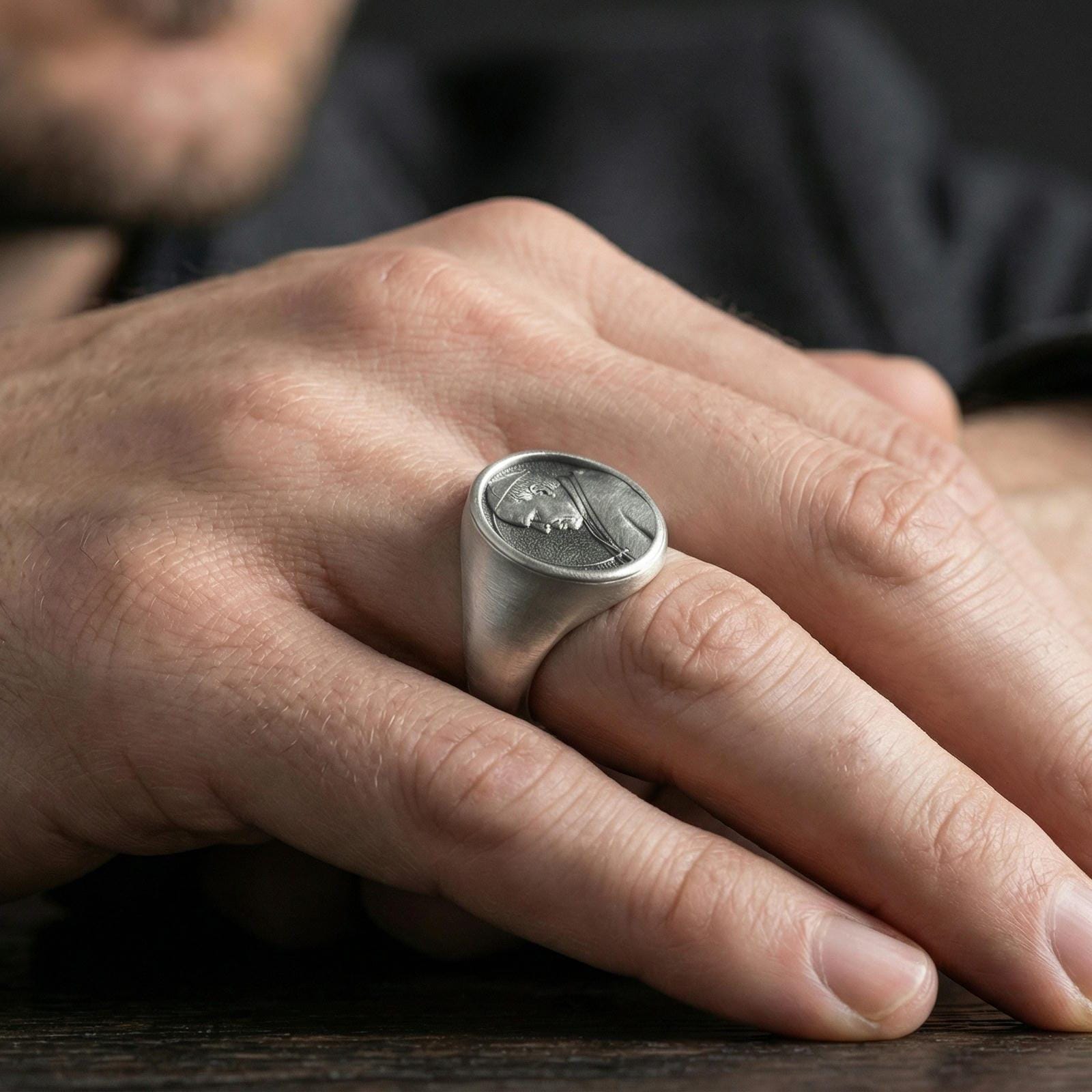 Oxidized 925 sterling silver Pope portrait signet ring worn on finger, Catholic medal style oval relief face