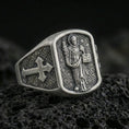 Load image into Gallery viewer, Oxidized 925 sterling silver Saint Dominic signet ring on volcanic rock, preacher saint relief with cross shoulder

