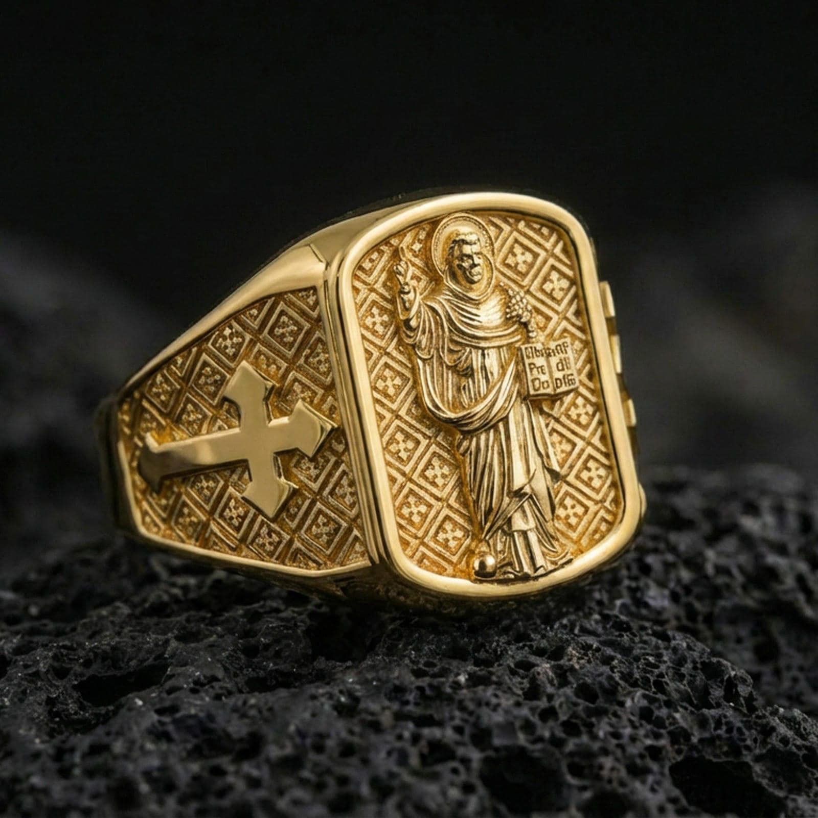 Gold plated Saint Dominic signet ring on dark volcanic rock, religious saint relief face with cross side panel