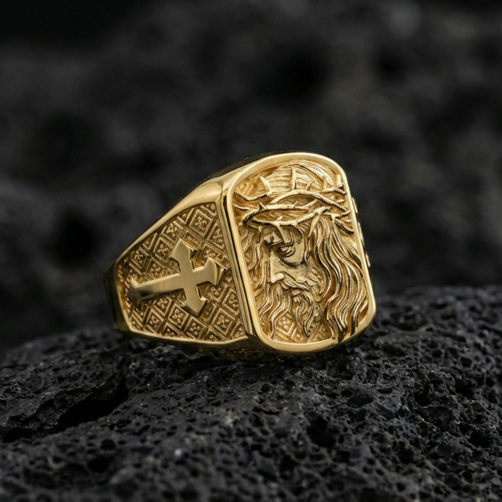 Gold plated Jesus ring on dark volcanic rock, Crown of Thorns engraving with cross motif side detail