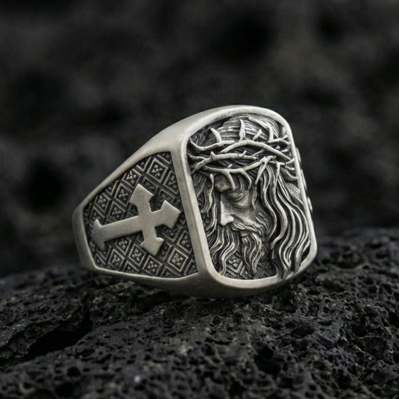 Oxidized 925 sterling silver Jesus ring on volcanic rock, Crown of Thorns relief with cross pattern side panel