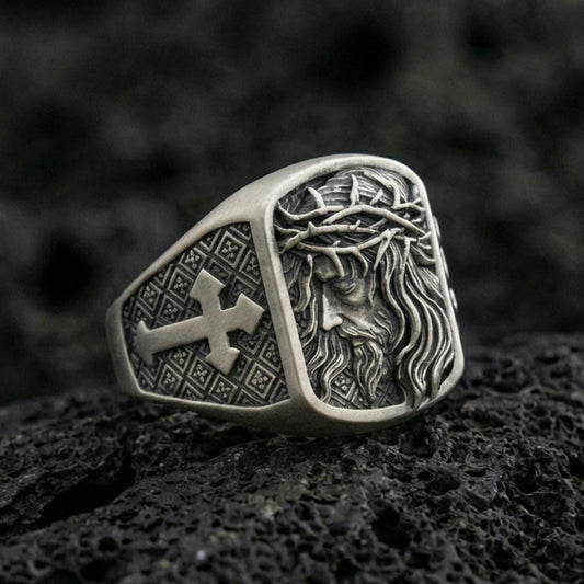 Oxidized 925 sterling silver Jesus ring on volcanic rock, Crown of Thorns relief with cross pattern side panel