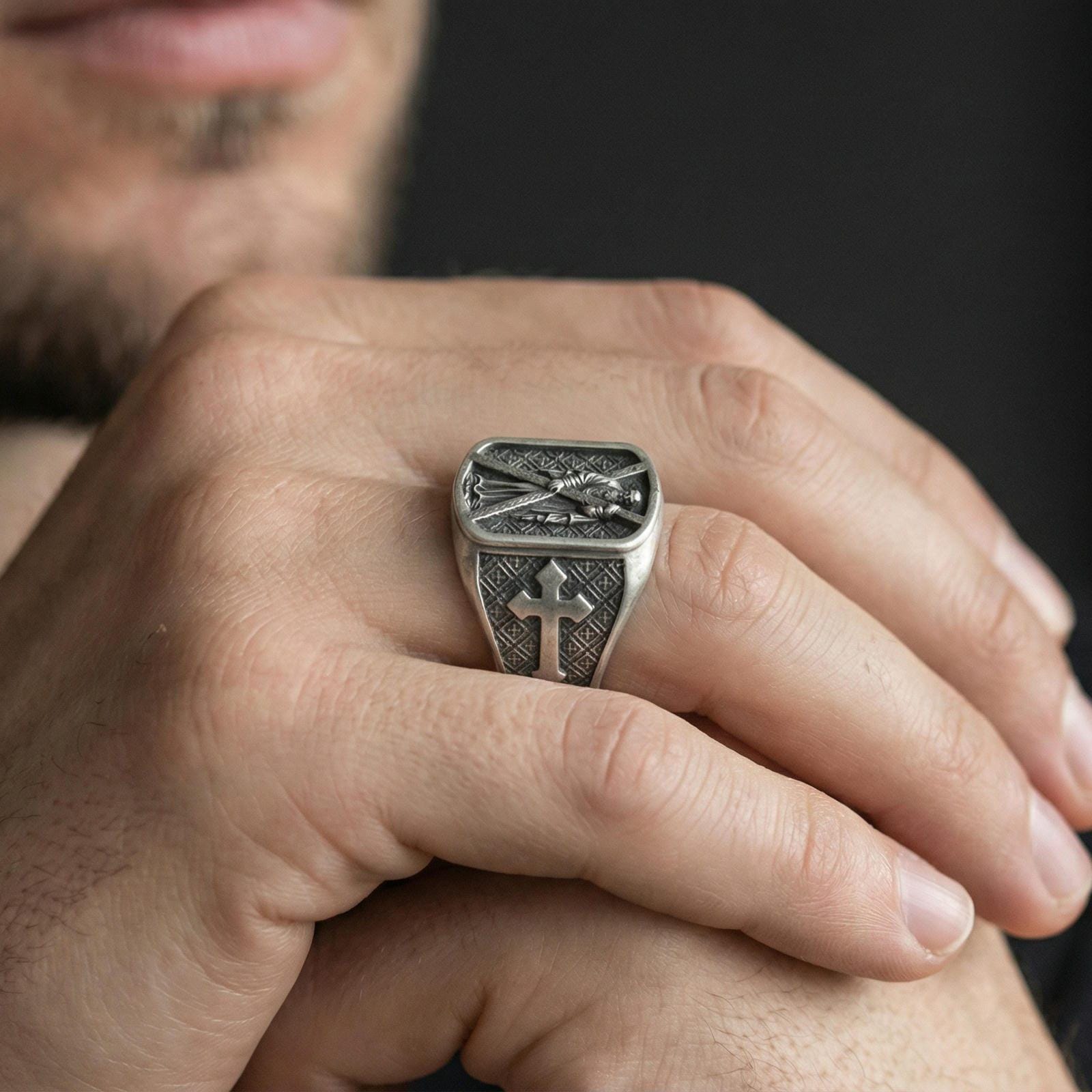 Oxidized 925 sterling silver Saint Andrew ring worn on finger, apostle holding cross with cross motif side panel