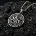 Load image into Gallery viewer, Oxidized 925 sterling silver triple moon pentagram pendant on volcanic rock, Celtic knot border with braided chain
