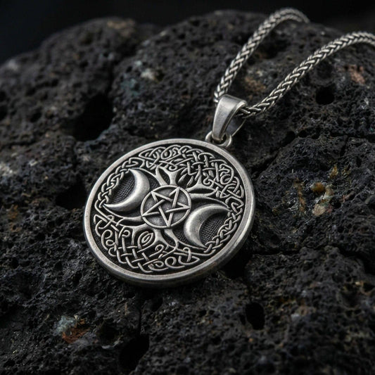 Oxidized 925 sterling silver triple moon pentagram pendant on volcanic rock, Celtic knot border with braided chain