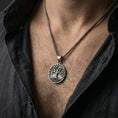 Load image into Gallery viewer, Oxidized 925 sterling silver Tree of Life pendant worn on neck, Yggdrasil medallion on braided chain
