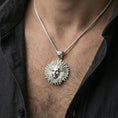 Load image into Gallery viewer, Polished silver Helios pendant necklace worn on neck, Greek sun god face with radiant sunburst design
