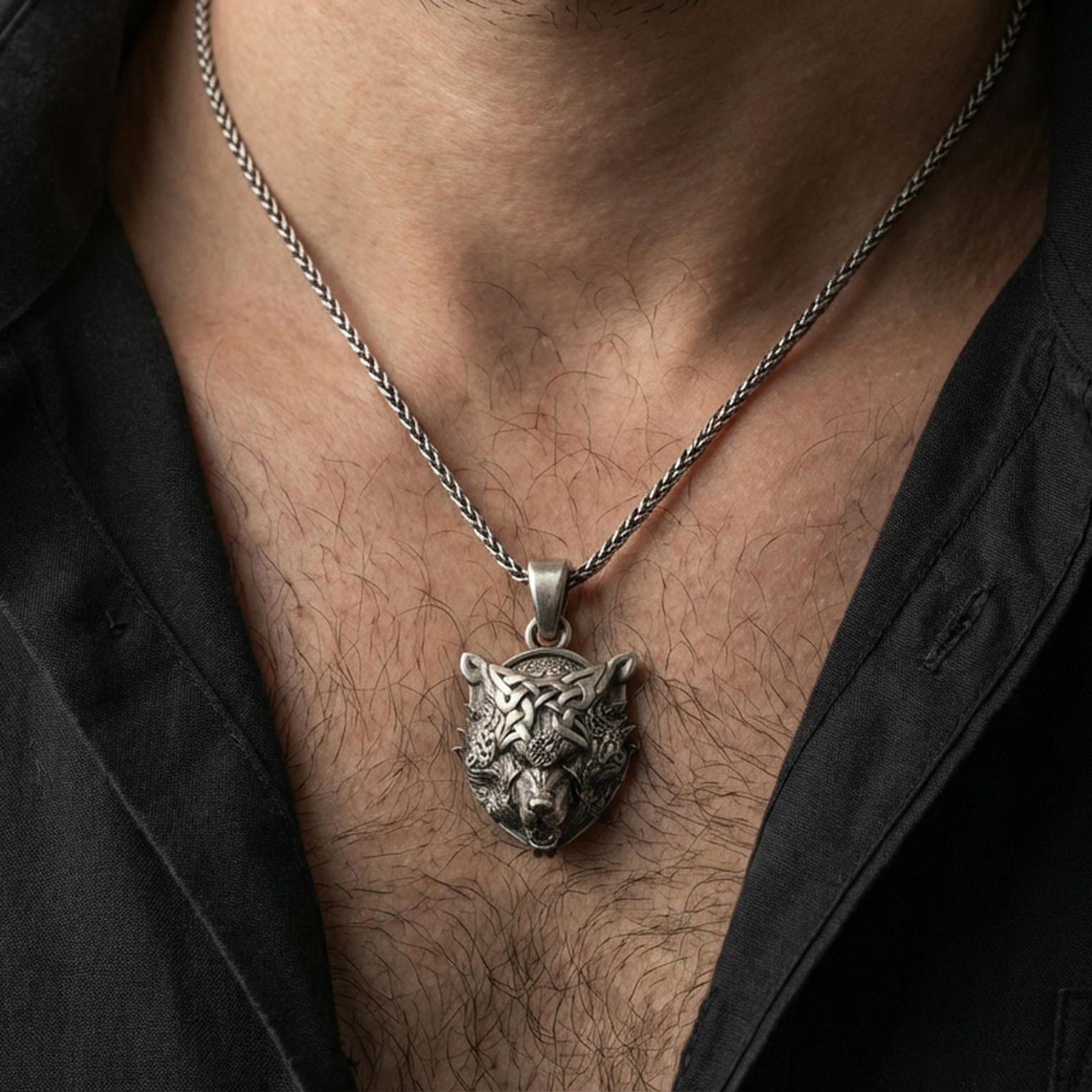 Oxidized 925 sterling silver Fenrir wolf pendant worn on neck, Norse Viking wolf head necklace with Celtic knotwork details