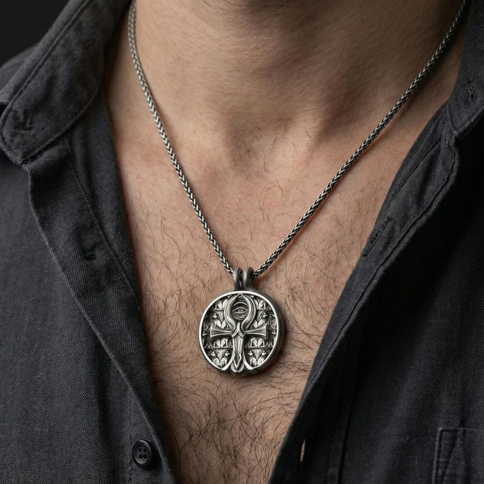 Oxidized 925 sterling silver ankh pendant worn on neck, Eye of Providence medallion with Egyptian-inspired detailing and bold relief finish