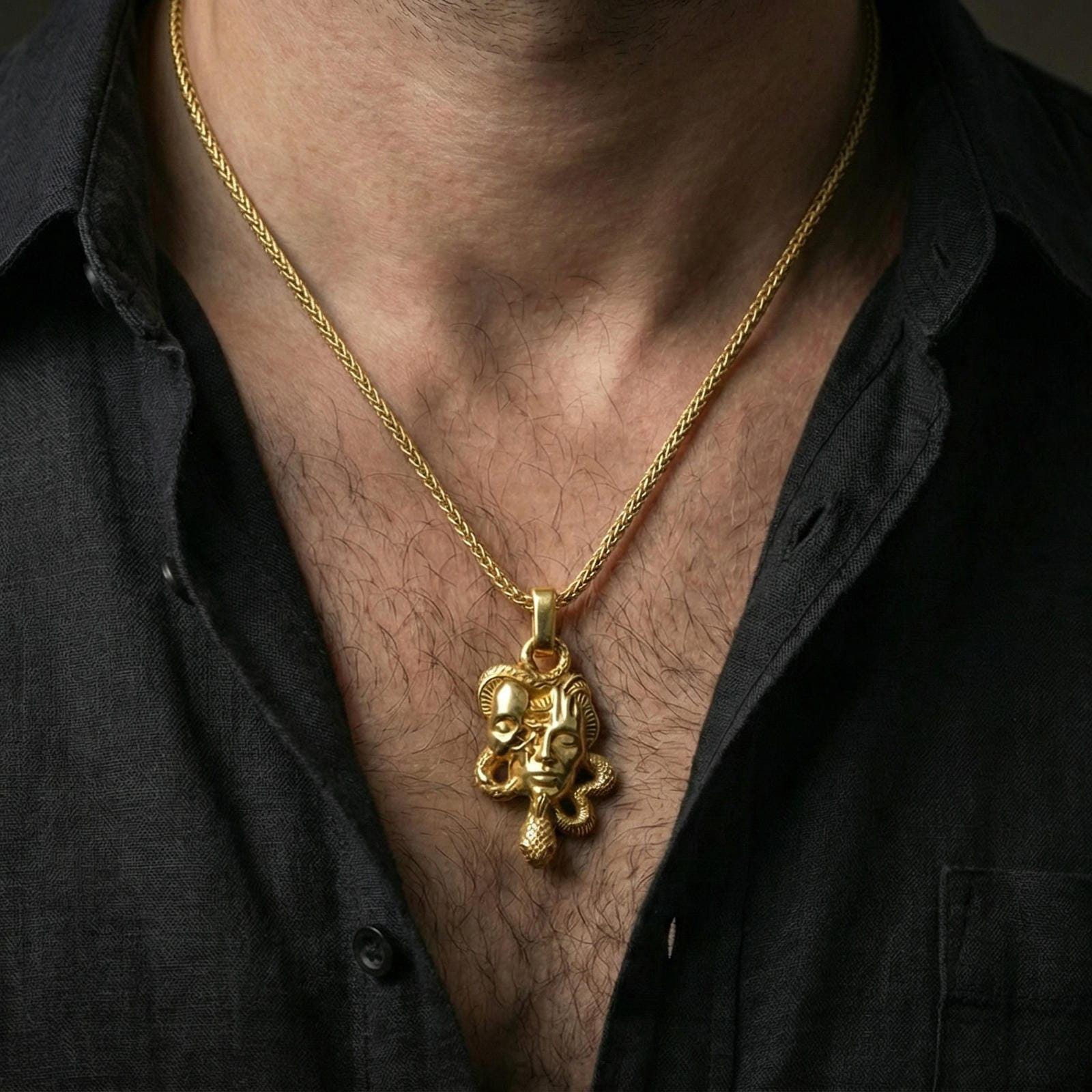 Gold plated Medusa skull pendant worn on neck, snake necklace with myth-inspired memento mori design and premium finish