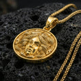 Load image into Gallery viewer, Gold plated medusa coin pendant on volcanic rock, greek gorgon necklace with luxury shine and serpent texture
