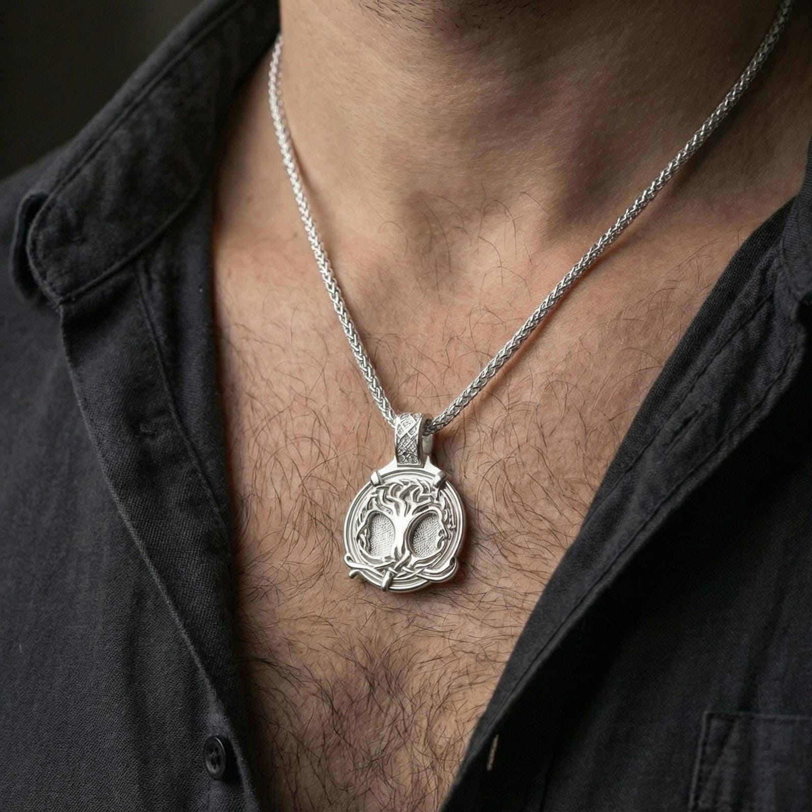 Polished silver yggdrasil tree of life necklace worn on neck, norse mythology pendant with braided frame detail