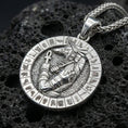 Load image into Gallery viewer, Polished silver Anubis necklace on porous volcanic stone, detailed Egyptian jackal god pendant with carved symbols
