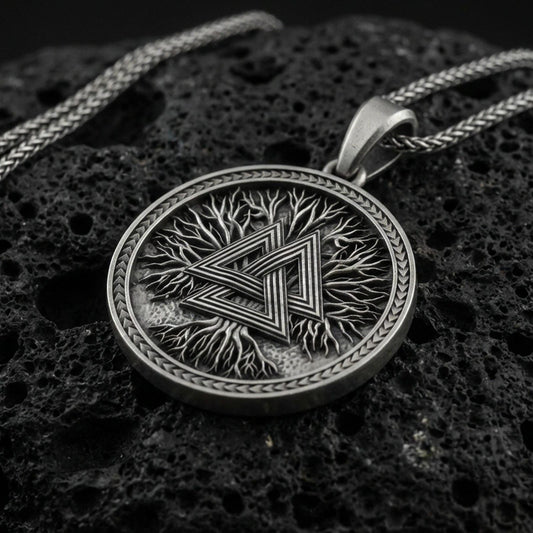 Oxidized 925 sterling silver valknut pendant on volcanic rock, Viking Norse symbol necklace with tree texture background