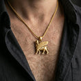 Load image into Gallery viewer, Gold plated lamassu pendant worn on neck, Babylonian Assyrian guardian necklace with premium finish and depth

