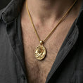 Load image into Gallery viewer, Gold plated Poseidon pendant worn on neck, Greek god trident necklace as a bold mythology statement piece
