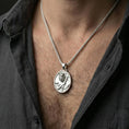 Load image into Gallery viewer, Polished silver Poseidon coin necklace worn on neck, detailed Greek sea god medallion pendant with strong relief
