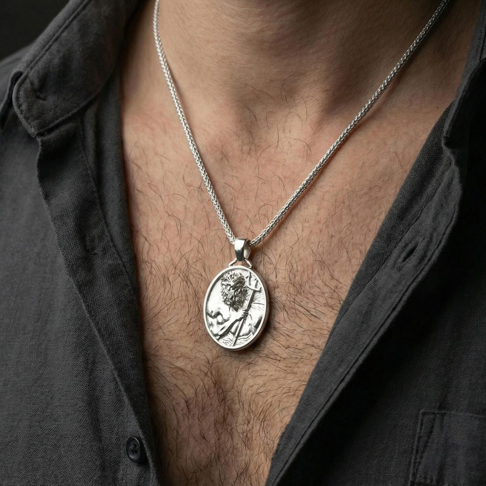 Polished silver Poseidon coin necklace worn on neck, detailed Greek sea god medallion pendant with strong relief